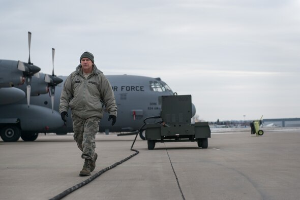 Master Sgt. Jim N. Erickson, 934th Aircraft Maintenance Squadron, conducts pre-flight maintenance at the Minneapolis-St. Paul Air Reserve Station, Minn. The maintenance squadrons must work through cold weather conditions that are present during the winter season. (U.S. Air Force photo by Staff Sgt. Corban D. Lundborg/Released) 