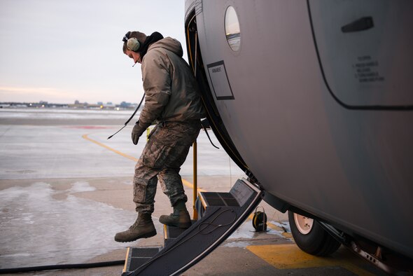 Staff Sgt. Seth D. Johnson, 934th Aircraft Maintenance Squadron, preforms routine pre-flight maintenance checks on a C-130 at the Minneapolis-St. Paul Air Reserve Station, Minn. The maintenance squadrons must work through cold weather conditions that are present during the winter season. (U.S. Air Force photo by Staff Sgt. Corban D. Lundborg/Released) 