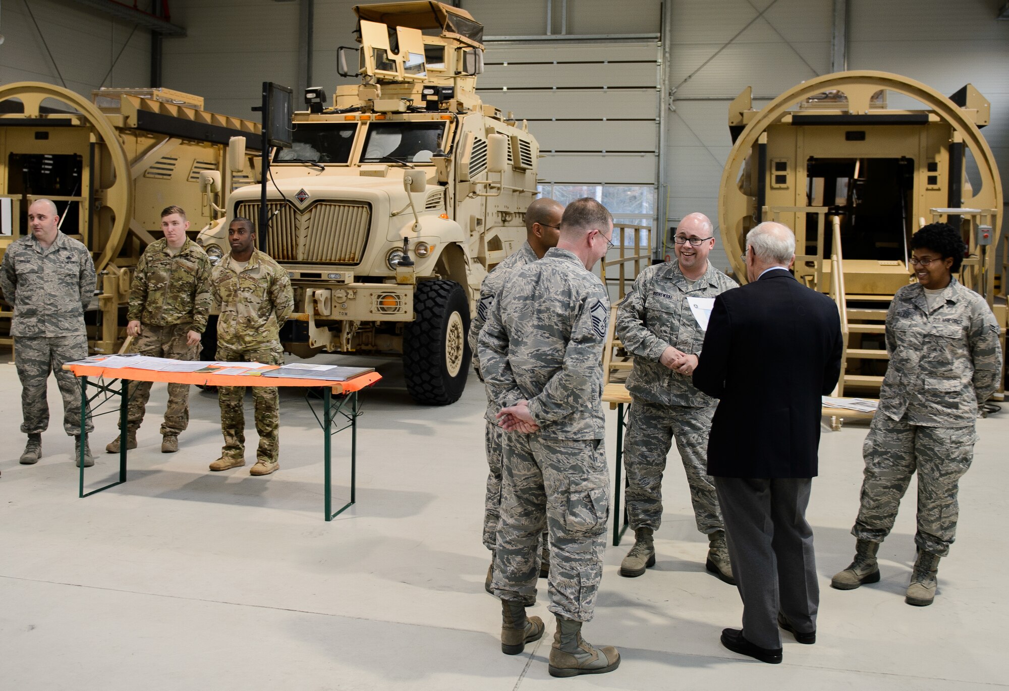 Airmen from the 7th Weather Squadron explain their mission and capabilities to Sam E. Parish, retired Chief Master Sergeant of the Air Force, Jan. 26, 2016 at Ramstein Air Base, Germany. During Parish’s visit in Germany he visited the 435th Air Ground Operations Wing to learn about their capabilities and accomplishments. (U.S. Air Force photo/Staff Sgt. Armando A. Schwier-Morales)