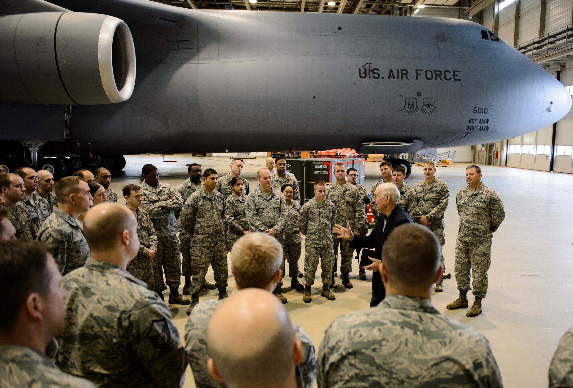 Sam E. Parish, retired Chief Master Sergeant of the Air Force, interacts with Airmen of the 721st Aircraft Maintenance Squadron Jan. 27, 2016, at Ramstein Air Base, Germany. Airmen from the 521st Air Mobility Operations Wing had an opportunity to meet Parish and discuss the differences from when Parish enlisted and the current Air Force. Parish was the guest speaker at a variety of venues including Airman Leadership School, squadron all calls, and the chief induction ceremony as part of his visit. (U.S. Air Force photo/Staff Sgt. Armando A. Schwier-Morales)
