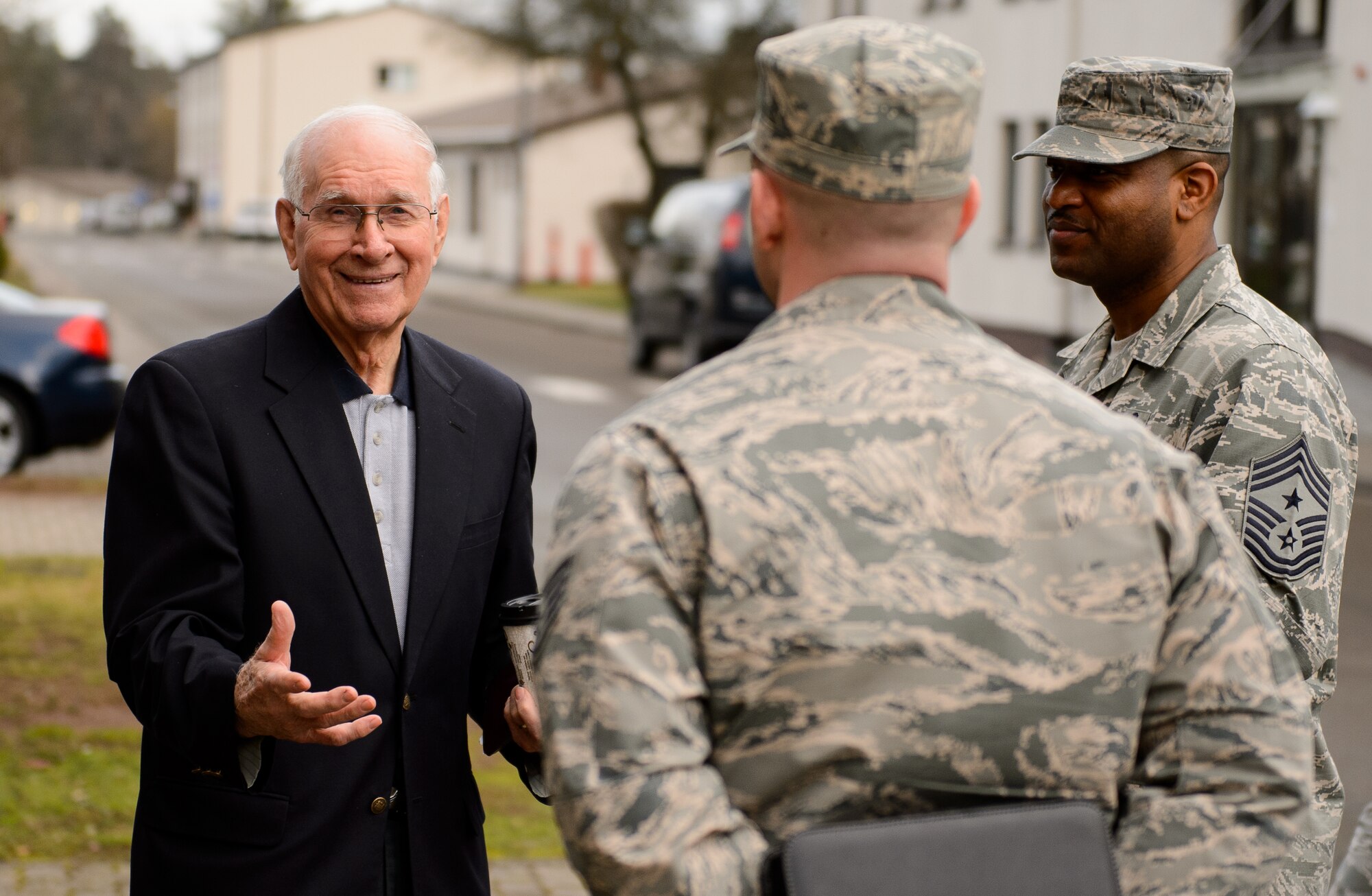 Sam E. Parish, retired Chief Master Sergeant of the Air Force, jokes with instructors of the Ramstein Airmen Leadership School Jan. 27, 2016, at Ramstein Air Base, Germany. Parish visited a variety of location around Germany and spoke with several organizations about their projects and how Airmen are taught professional military education. (U.S. Air Force photo/Staff Sgt. Armando A. Schwier-Morales)