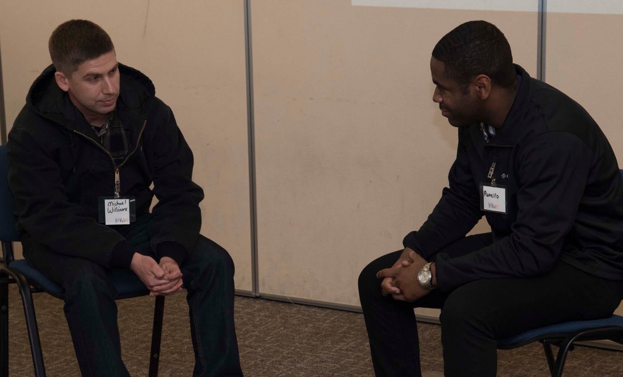 U.S. Air Force Airman 1st Class Michael Williams, left, a power production election member with the 35th Civil Engineer Squadron, talks with Airman 1st Class Romello Barbour, right, an electrical systems apprentice with the 35th Civil Engineer Squadron, at Misawa Air Base, Japan, Jan. 29, 2016. Through shared personal experiences during Applied Suicide Intervention Skills Training, participants experienced practice for handling situations of suicide risk. Williams is from Valley Springs, California, and Barbour hails from York, Pennsylvania. (U.S. Air Force photo by Airman 1st Class Jordyn Fetter)