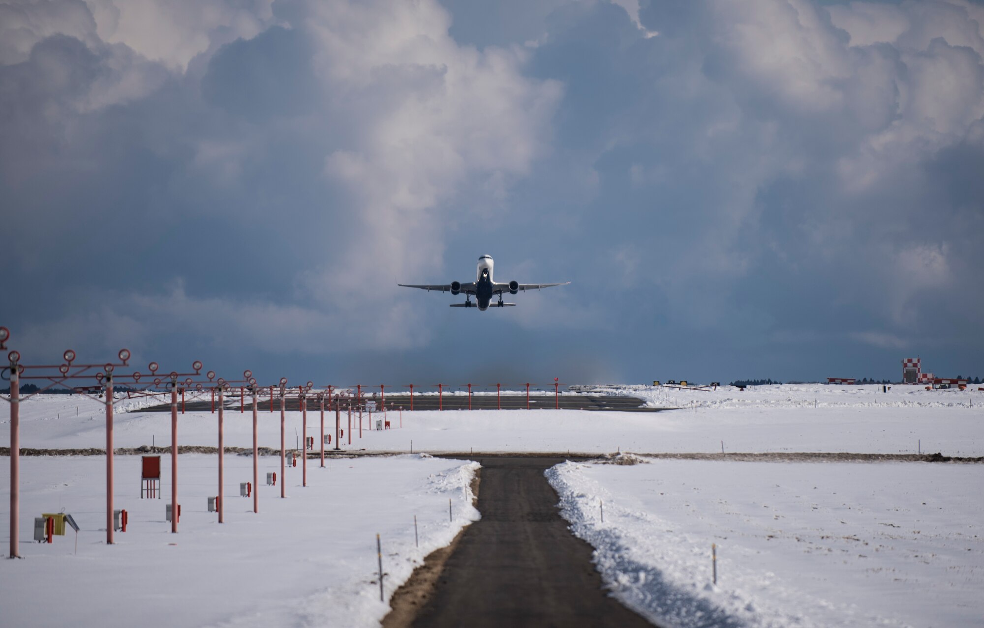 A Boeing 757 takes off Jan. 30, 2016, at Misawa Air Base, Japan. The aircraft transported more than 120 Airmen to Andersen Air Force Base, Guam. Every year Andersen AFB hosts Cope North, a multinational deployment that employs numerous Airmen across the base to help improve combat readiness, develop a synergistic disaster response and increase interoperability between partner nations. (U.S. Air Force photo by Senior Airman Brittany A. Chase)