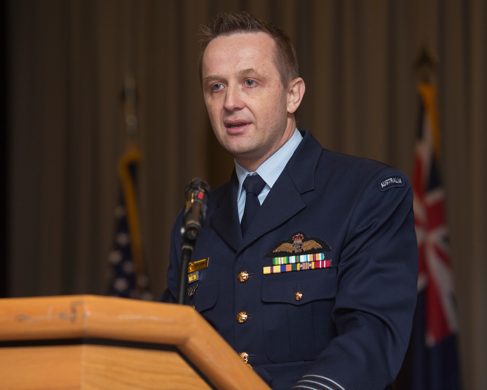 Royal Australian Air Force Group Captain Michael Jansen, United Nations Command (Rear) commander, gives a speech during the UNC (Rear) change of command ceremony at Yokota Air Base, Japan, Jan. 26, 2016. As the United Nations Command’s principal representative in Japan, the UNC (Rear) maintains the status of forces agreement regarding United Nations Forces in Japan during armistice conditions. (U.S. Air Force photo by Osakabe Yasuo/Released)
