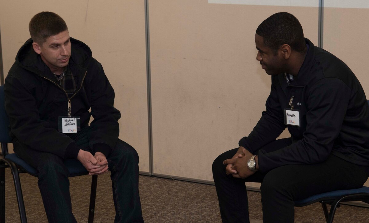 U.S. Air Force Airman 1st Class Michael Williams, left, a power production election member with the 35th Civil Engineer Squadron, talks with Airman 1st Class Romello Barbour, right, an electrical systems apprentice with the 35th Civil Engineer Squadron, at Misawa Air Base, Japan, Jan. 29, 2016. Through shared personal experiences during Applied Suicide Intervention Skills Training, participants experienced practice for handling situations of suicide risk. Williams is from Valley Springs, California, and Barbour hails from York, Pennsylvania. (U.S. Air Force photo by Airman 1st Class Jordyn Fetter)