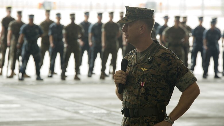 U.S. Marine Corps Lt. Col. Karl T. Schmidt, outgoing Headquarters and Headquarters Squadron commanding officer, addresses the audience during a change of command ceremony at Marine Corps Air Station Iwakuni, Japan, June 30, 2016. Schmidt served honorably and faithfully as commanding officer for H&HS since June 9, 2016, and will remain at Marine Corps Air Station Iwakuni as the airfield station operations officer for approximately 10 months. (U.S. Marine Corps photo by Lance Cpl. Donato Maffin/Released)