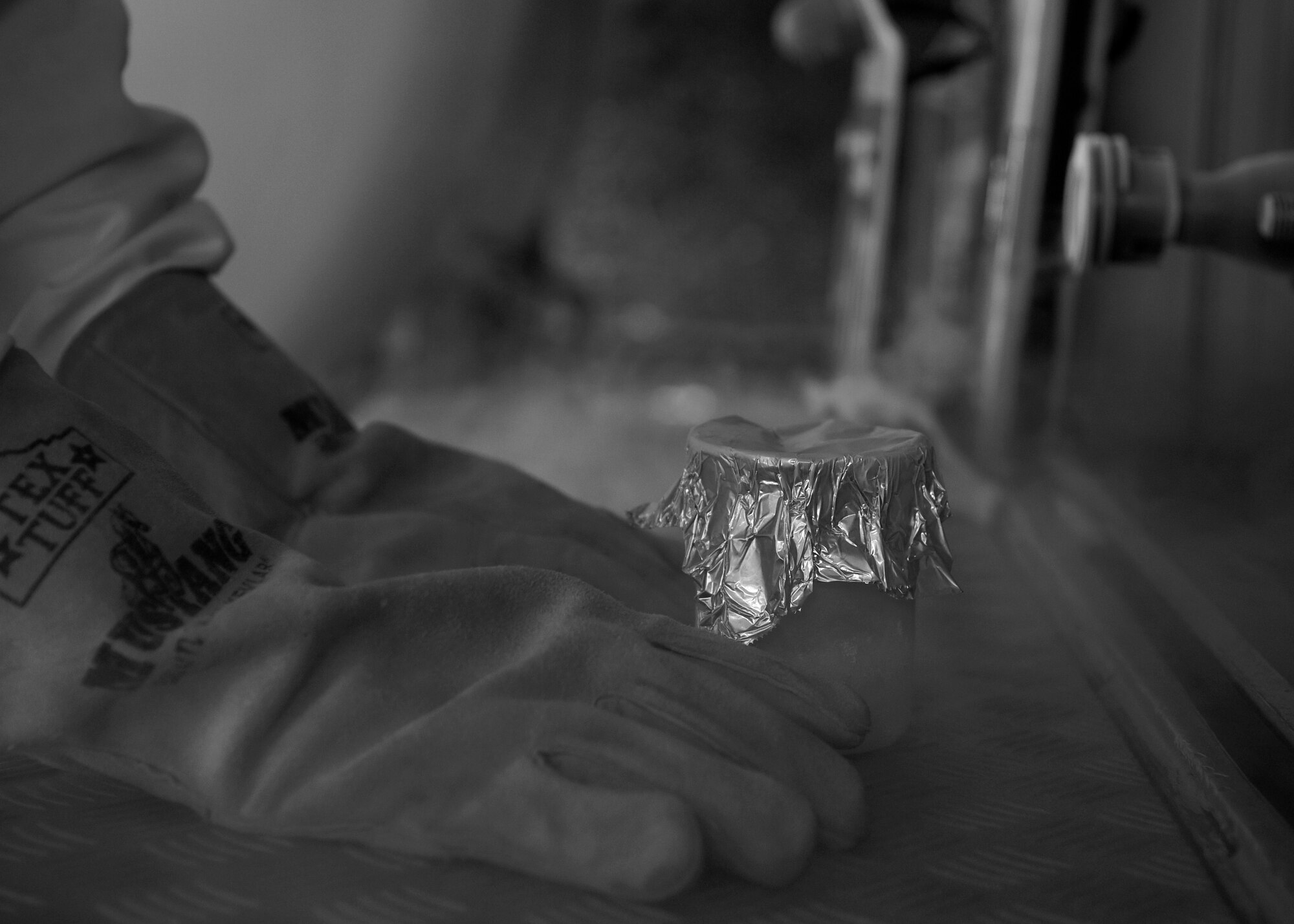 U.S. Air Force Airman Wesley Henderson, a fuels distribution technician with the 35th Logistics Readiness Squadron, waits to pick up a jar of liquid oxygen at Misawa Air Base, Japan, June 29, 2016. Every three to four months, fuels Airmen refill liquid oxygen tanks. Before they can refill the tanks, the liquid oxygen must undergo an odor test to see if it is contaminated. Henderson hails from Topsham, Maine. (U.S. Air Force photo by Senior Airman Deana Heitzman)