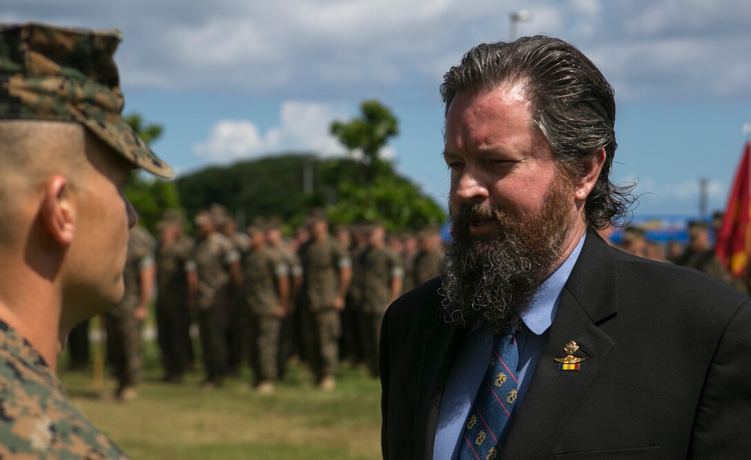 Retired Master Sgt. Robert Alexander Jr. receives his fourth Navy and Marine Corps Commendation medal June 23, 2016, at Camp Schwab, Okinawa, Japan. He is receiving it for his life-saving actions in Subic Bay, Philippines, after a night-time amphibious training exercise in 1988. He is a Fitchburg, Massachusetts, native living in Okinawa, Japan. (U.S. Marine Corps photo by Cpl. Tyler Ngiraswei/ Released)