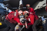 Sailors prepare to load ordnance onto a Navy F/A-18E Super Hornet assigned to Strike Fighter Squadron 86 on the flight deck of the aircraft carrier USS Dwight D. Eisenhower, deployed in the Mediterranean Sea, June 28, 2016. The USS Eisenhower is deployed in support of Operation Inherent Resolve, the U.S.-led coalition to degrade and defeat the Islamic State of Iraq and the Levant.