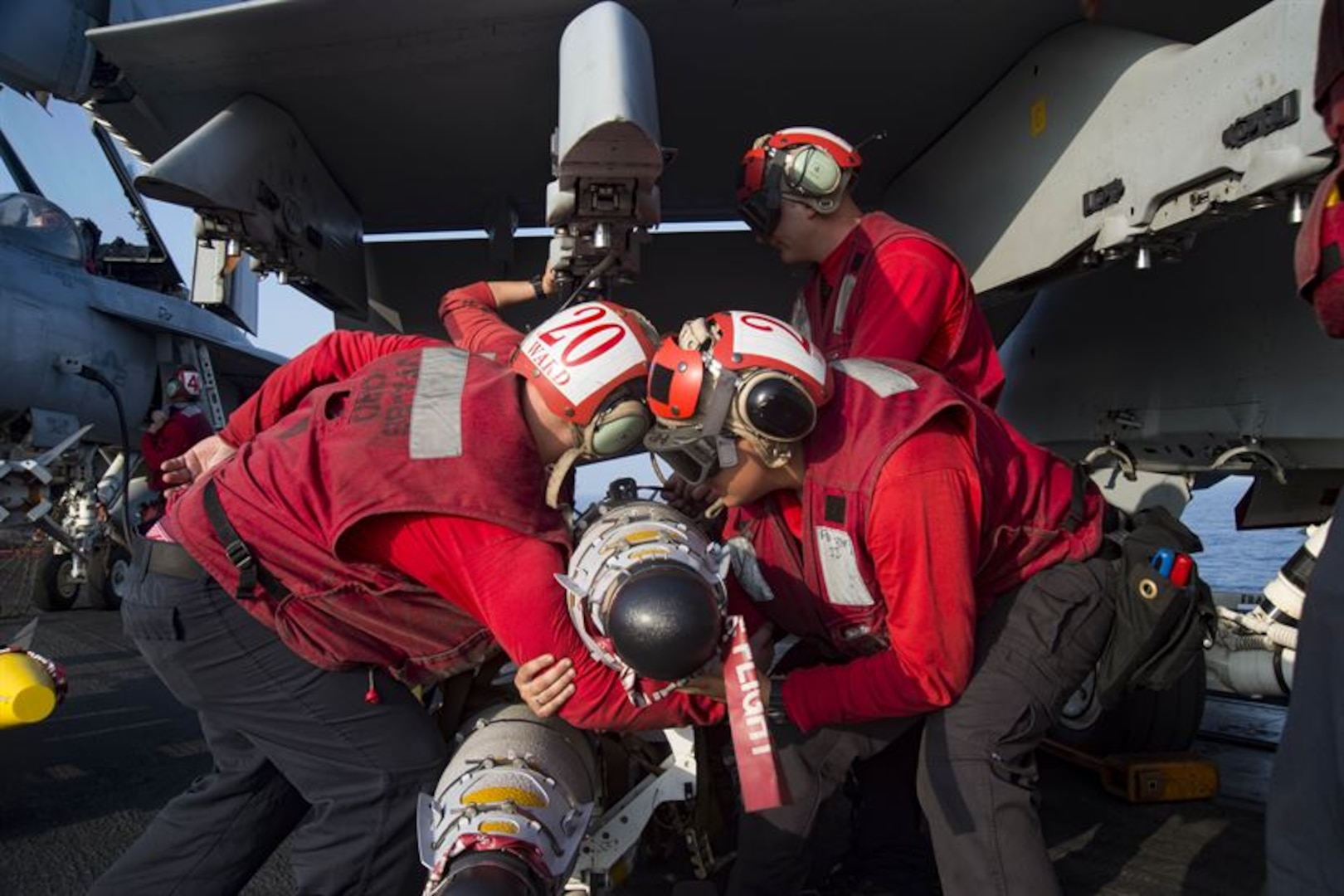 Sailors prepare to load ordnance onto a Navy F/A-18E Super Hornet assigned to Strike Fighter Squadron 86 on the flight deck of the aircraft carrier USS Dwight D. Eisenhower, deployed in the Mediterranean Sea, June 28, 2016. The USS Eisenhower is deployed in support of Operation Inherent Resolve, the U.S.-led coalition to degrade and defeat the Islamic State of Iraq and the Levant.