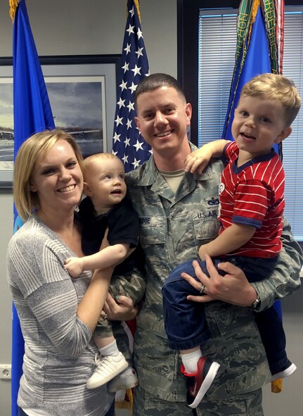 Nicole R. Bridge, who recently earned the 2016 Joan Orr Air Force Spouse of the Year Award, stands with her husband, Tech. Sgt. Matthew Bridge, a 521st Air Mobility Operations Wing command chief executive assistant, and their two sons on June 28, 2016, at Ramstein Air Base, Germany. Bridge volunteered more than 1,200 hours, organized 125 events and generated $250,000 dollars for distribution into the local community. (Courtesy photo)