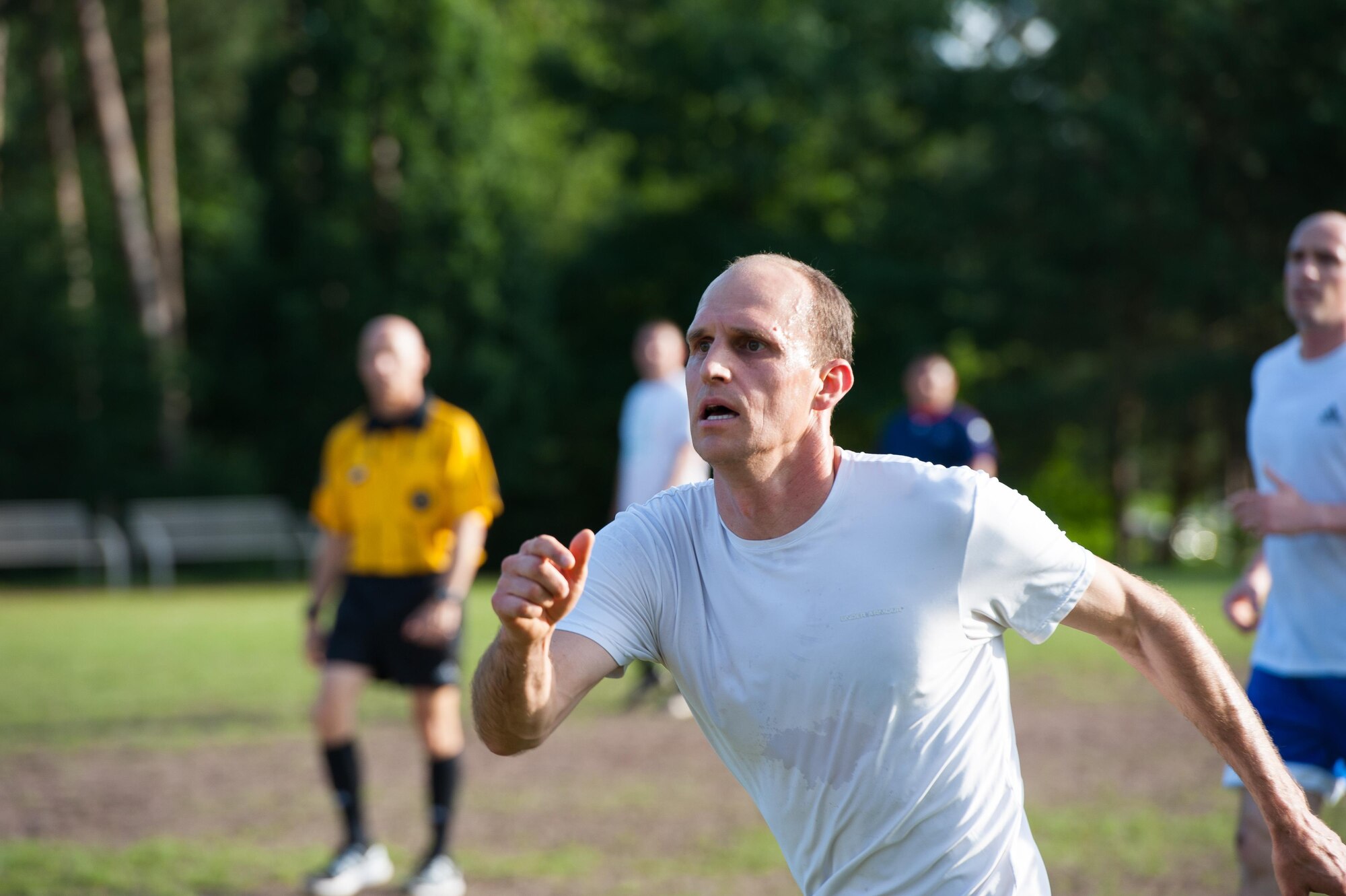 Maj. Casey Chronister, 76th Airlift Squadron C-21 instructor pilot, runs down the soccer field during the Ramstein intramural soccer finals June 29, 2016, at Ramstein Air Base, Germany. After the full season ends, all participating units then compete in a tournament-style final where teams play double-elimination matches until one team is left. (U.S. Air force photo/Airman 1st Class Lane T. Plummer)
