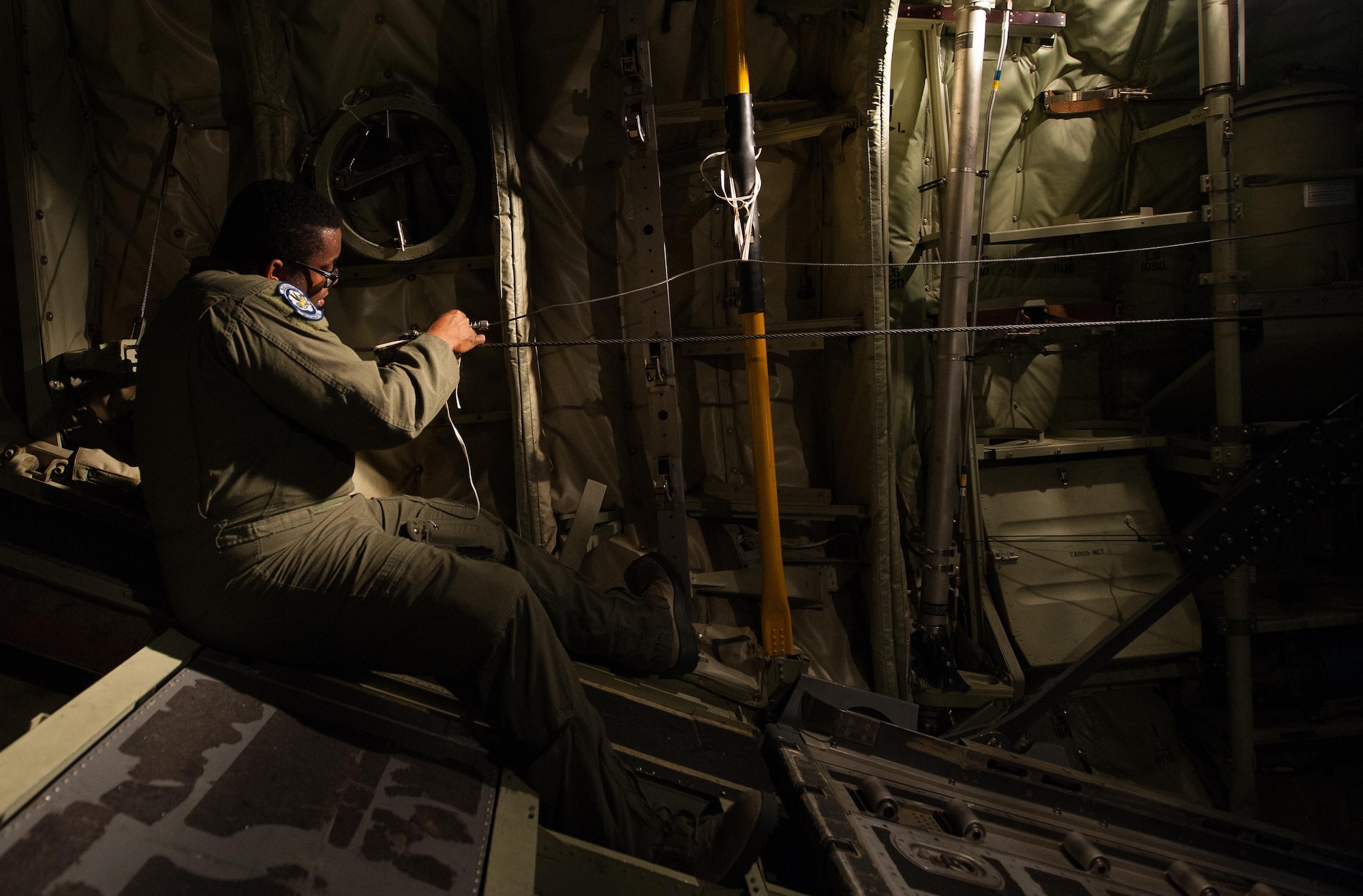 Senior Airman Warren Purnell, 37th Airlift Squadron loadmaster, prepares a C-130J Super Hercules for take-off during a Joint Airborne Air Transportability Training exercise June 30, 2016, at Ramstein Air Base, Germany. Airmen maintain their sharp on-the-job skills by performing these JA/ATT exercises frequently, ensuring that the mission can continue without a hiccup. (U.S. Air force photo/Airman 1st Class Lane T. Plummer)
