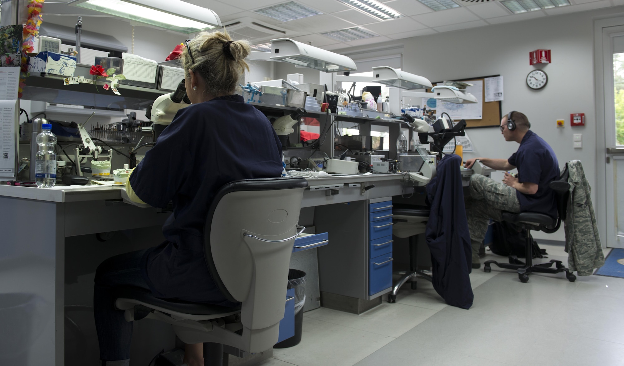 Two dental lab technicians from the 86th Dental Squadron work on teeth molds June 30, 2016, at Ramstein Air Base, Germany. The dental lab provides false teeth, crowns, hard night guards, sports guards, retainers and more for Ramstein and several other bases throughout U.S. Air Forces in Europe. (U.S. Air Force photo/Airman 1st Class Tryphena Mayhugh)