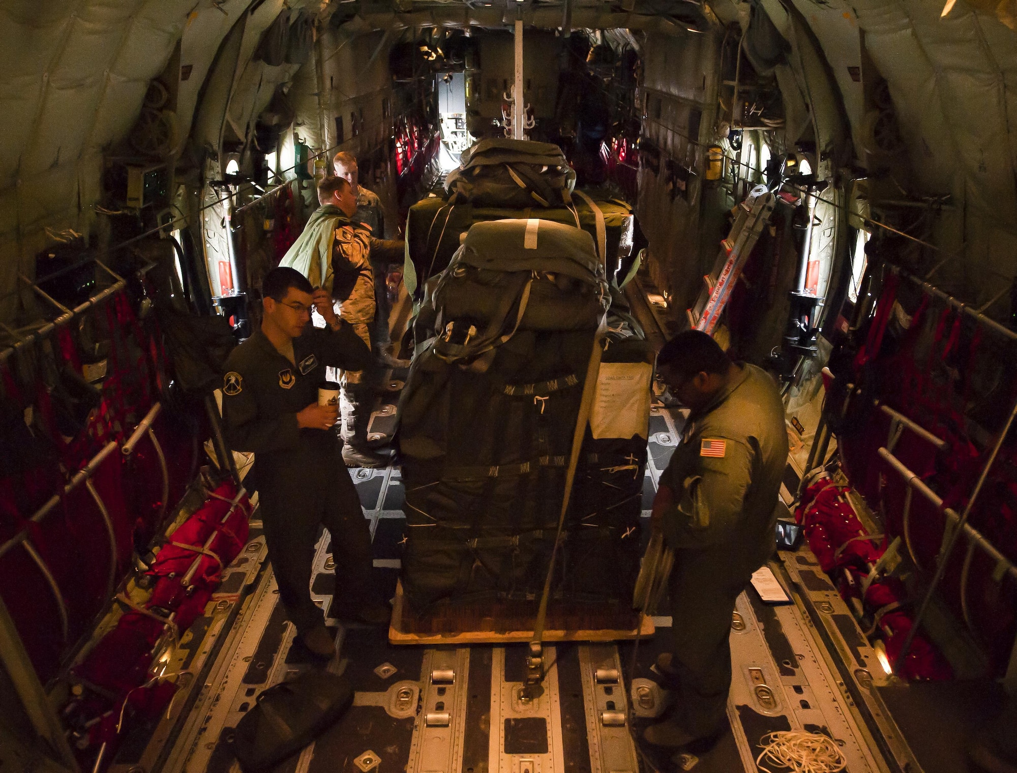 The crew of a C-130J Super Hercules inspect its cargo before taking off during a Joint Airborne Air Transportability Training exercise June 30, 2016, at Ramstein Air Base, Germany. The 37th Airlift Squadron prepares Airmen for future missions by participating in JA/ATT exercises with other units several times a month. (U.S. Air force photo/Airman 1st Class Lane T. Plummer)