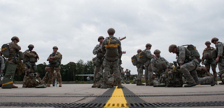 Airmen from the 2nd Air Support Operations Squadron prepare to board a C-130J Super Hercules during a Joint Airborne Air Transportability Training exercise June 30, 2016, at Ramstein Air Base, Germany. These Airmen maintain their proficiency in working cohesively during real-world events by participating in JA/ATT exercises several times a month with the 37th Airlift Squadron. (U.S. Air force photo/Airman 1st Class Lane T. Plummer)