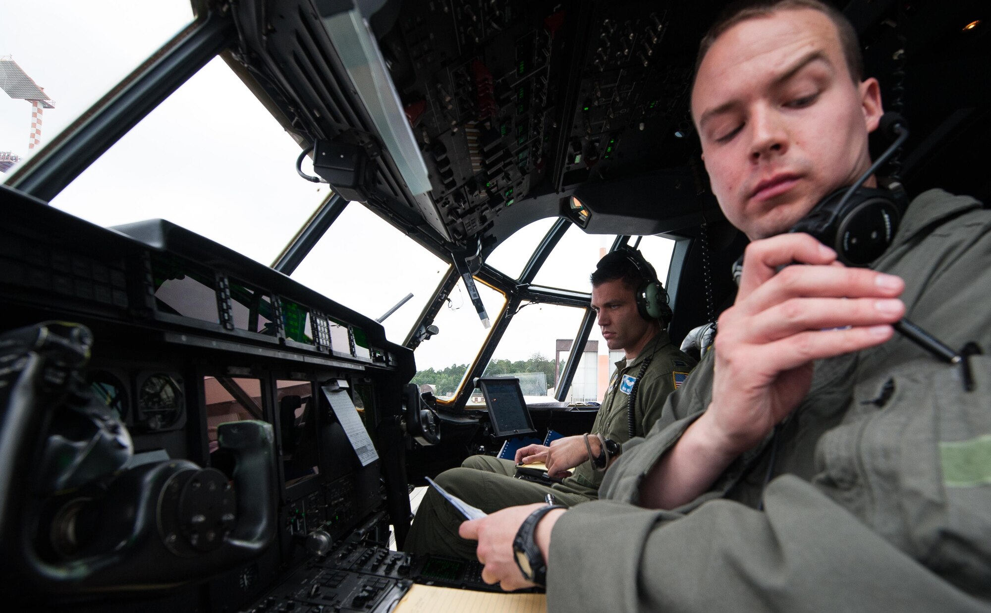 First Lt. Robert Lahr and Capt. Brian Vos, 37th Airlift Squadron pilots, prepare a C-130J Super Hercules for take-off during a Joint Airborne Air Transportability Training exercise June 30, 2016, at Ramstein Air Base, Germany. The 37th AS maintains mission readiness by integrating JA/ATT training alongside other units such as the 2nd Air Support Operations Squadron. (U.S. Air force photo/Airman 1st Class Lane T. Plummer)