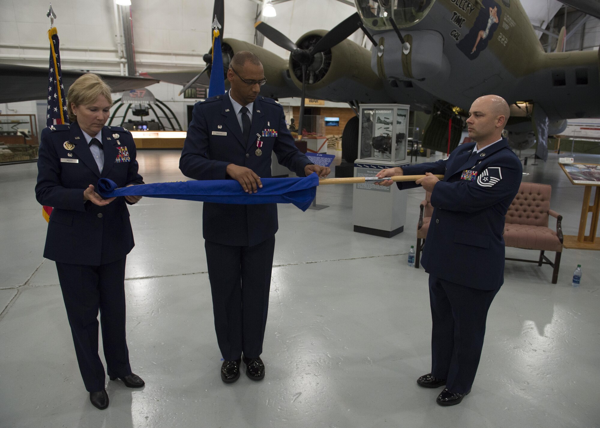 Col. Kathryn Weiss, 436th Medical Group commander, and Lt. Col. Eric Baugh, 436th Dental Squadron out-going commander, case the 436th DS guidon during the 436th Dental Squadron Inactivation Ceremony on June 28, 2016, at the Air Mobility Command Museum on Dover Air Force Base, Del. This ceremony formally retires the squadron’s guidon, marking a closing chapter in the squadron’s history. (U.S. Air Force photo/Senior Airman Zachary Cacicia)