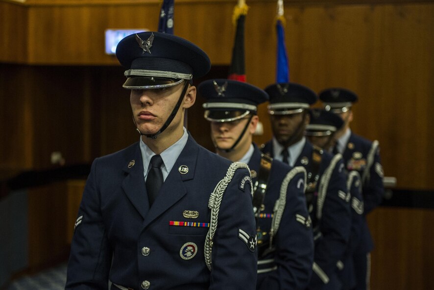A Spangdahlem Air Base ceremonial guardsmen detail present the colors during the 52nd Communications Squadron change of command ceremony at the Brickhouse on Spangdahlem Air Base, Germany, June 29, 2016. It is tradition for the guardsmen to post both the United States and the host nation’s flags depending on where they are stationed. (U.S. Air Force photo by Senior Airman Luke Kitterman/Released)