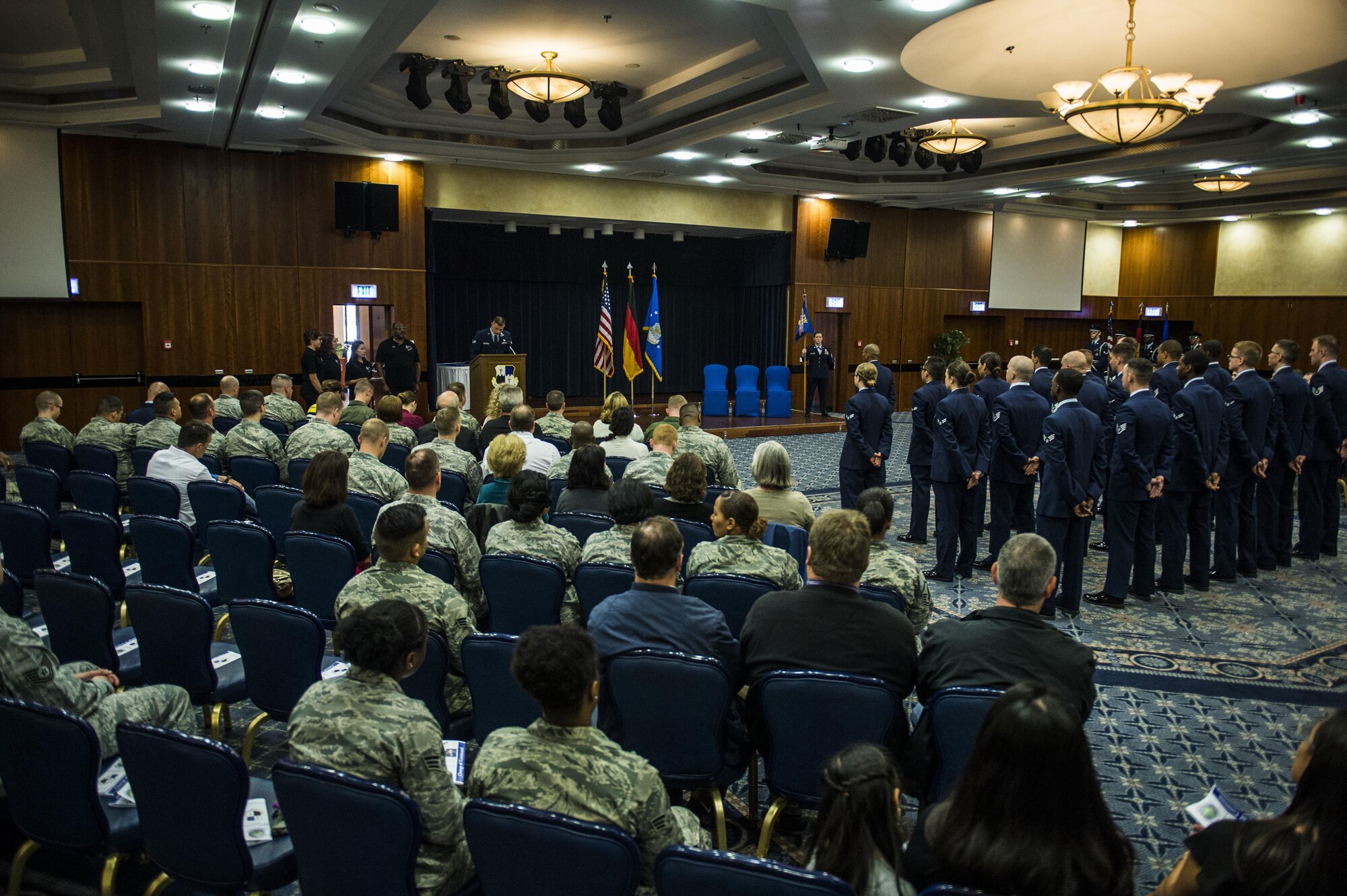 Airmen and members of the Spangdahlem community gather for the 52nd CS change of command ceremony in the Club Eifel Ballroom at Spangdahlem Air Base, Germany, July 1, 2016. More than 100 people were in attendance of the ceremony. (U.S. Air Force photo by Senior Airman Luke Kitterman/Released)