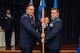 U.S. Air Force Col. Steven Zubowicz, 52nd Mission Support Group commander, left, passes the 52nd Communications Squadron guidon to U.S. Air Force Maj. Christopher Waddell, 52nd CS commander, during the 52nd CS change of command ceremony in the Club Eifel Ballroom at Spangdahlem Air Base, Germany, July 1, 2016. The passing of the guidon is military tradition when exchanging command. (U.S. Air Force photo by Senior Airman Luke Kitterman/Released)