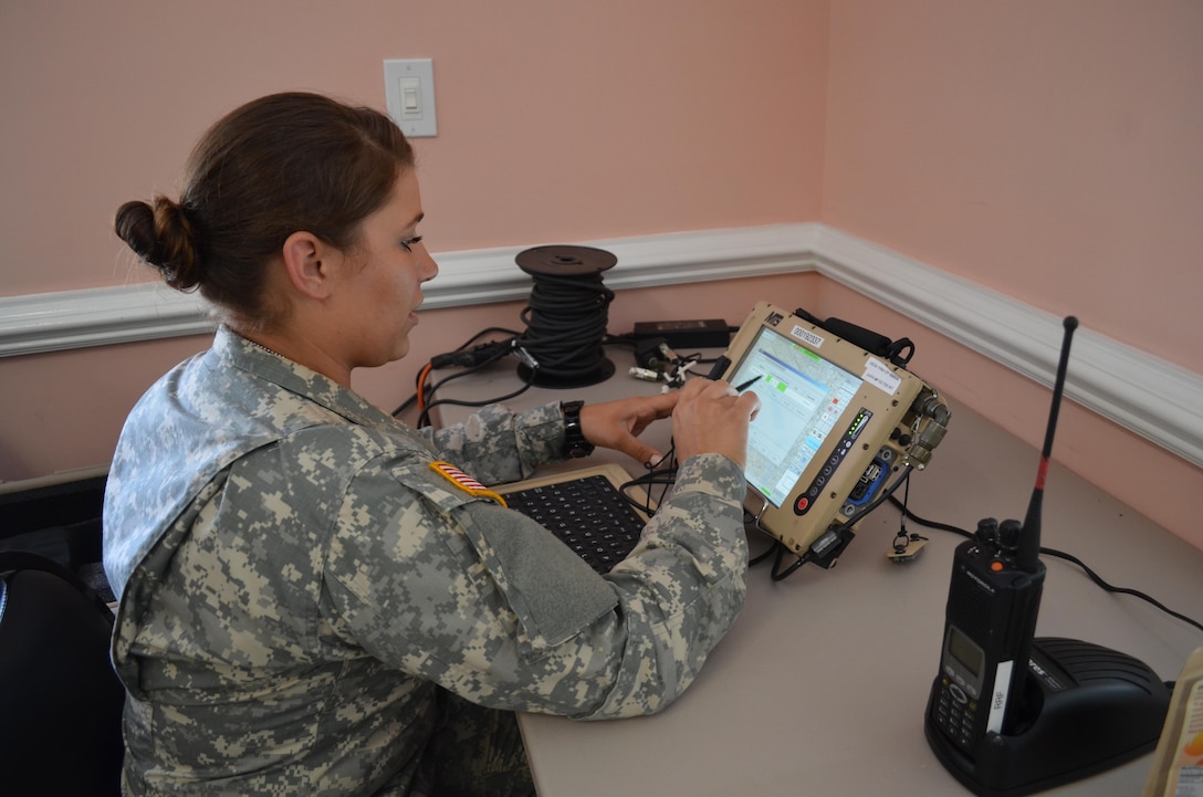 Army Pvt. Noel Weeks, with the North Carolina Army National Guard’s 210th Military Police Company, works in the tactical operations center during Operation Vigilant Sea Hawk in Sunny Point, N.C., June 16, 2016. The operation is a two-week regional homeland security exercise with disaster response missions designed to test and improve communication and the response of the North Carolina National Guard and partners within the state and federal agencies. North Carolina Army National Guard photo by Sgt. Odaliska Almonte