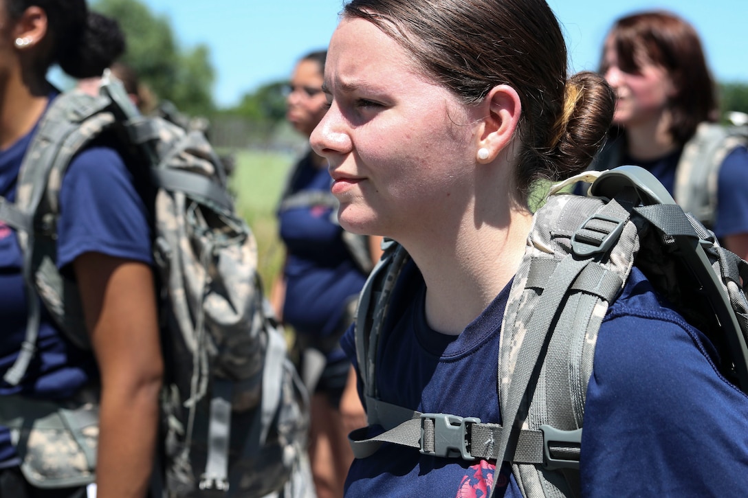 U.S. Marine Corps enlistee Chartre Deshong, from Recruiting Substation Carlisle, stands at attention in formation after a 4-mile hike through the Appalachian Trail in Carlisle, Penn., on Saturday, June 18, 2016. Two miles into the hike, the poolees were given 20 minutes for lunch during which proper nutrition habits were discussed. The purpose of the hike was to provide training as well as mentorship to female poolees by teaching them the proper way to pack and carry heavy loads during hikes prior to leaving for boot camp.  (U.S. Marine Corps photo by Sgt. Anne K. Henry/Released) 