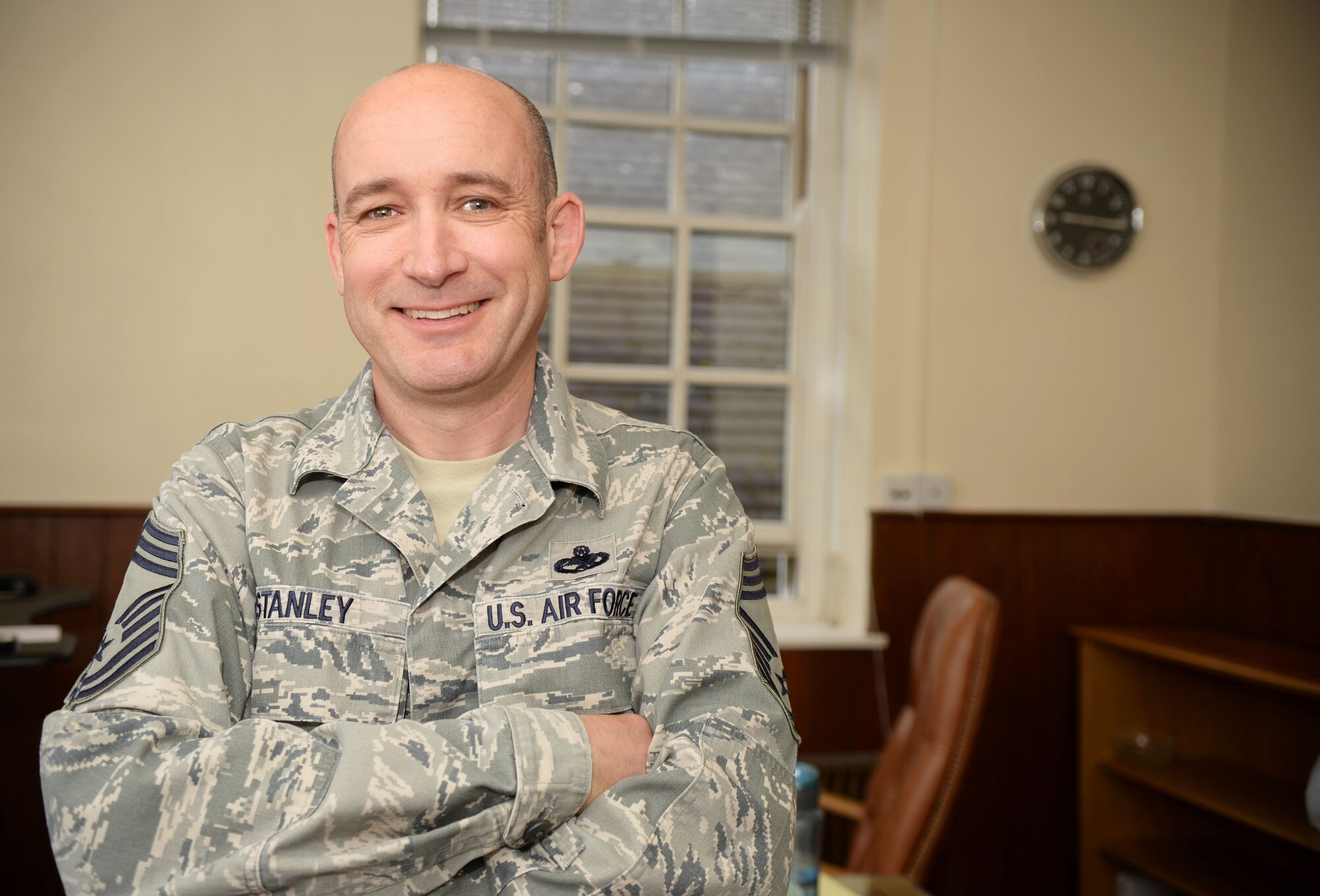 U.S. Air Force Chief Master Sgt. Curt Stanley, 100th Air Refueling Wing command chief, stands in his new office June 29, 2016, on RAF Mildenhall, England. Stanley has been a part of Team Mildenhall for four years and served as the 100th Maintenance Group superintendent before assuming the role as the 100th ARW command chief July 1, 2016. (U.S. Air Force photo by Airman 1st Class Tenley Long/Released)