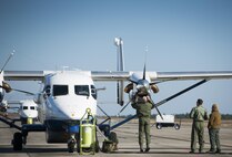 An aircrew member checks the intake of an engine on a C-145A Skytruck prior to an airdrop mission at Duke Field, Fla.  The Skytrucks are primarily used for new aircrew qualifications and flight proficiency missions.  (U.S. Air Force photo/Tech. Sgt. Sam King)  