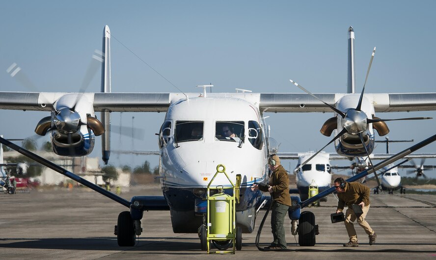 Maintainers with the 919th Special Operations Maintenance Group pull the generator cable and chocks as the aircrew of a C-145A Skytruck prepares for a mission at Duke Field, Fla.  The 919th MXG is responsible for the maintenance of the five Skytrucks in the Air Force fleet.  (U.S. Air Force photo/Tech. Sgt. Sam King)   