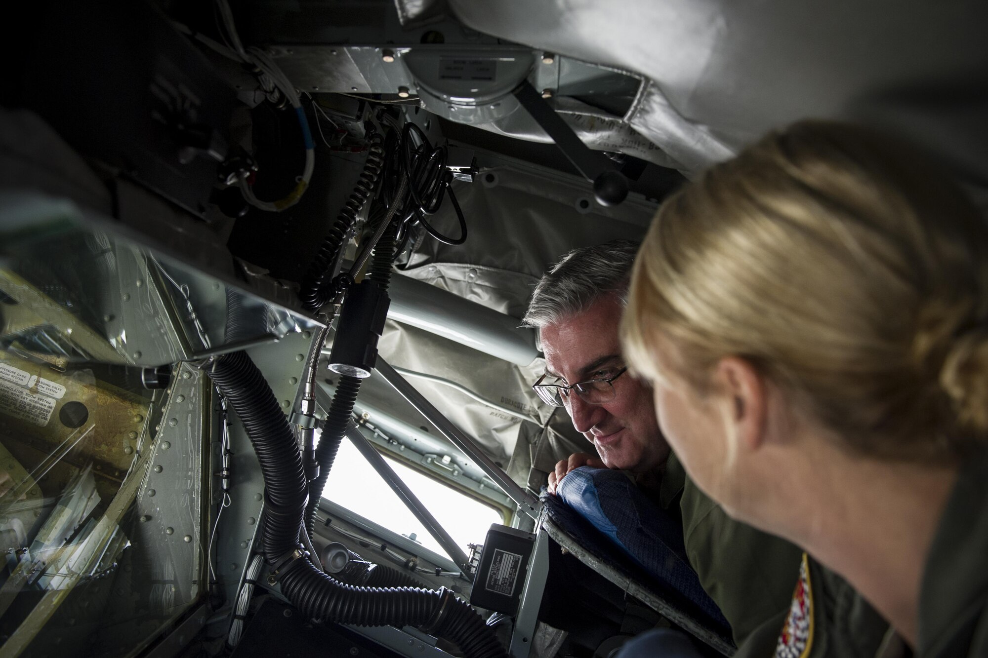 Master Sgt. Deborah Wood, 74th Air Refueling Squadron inflight refueling technician, explains to Indiana Lt. Gov. Eric Holcomb inflight equipment that connects a KC-135R Stratotanker to a receiver aircraft inflight to transfer fuel at Grissom Air Reserve Base, June 28, 2016. Holcomb, a Navy veteran, met with Hoosier Airmen to learn about Grissom’s operational capabilities and economic impact during his first tour of the base. (U.S. Air Force photo/Staff Sgt. Katrina Heikkinen)