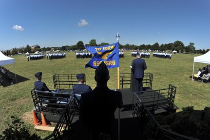 Chief Master Sgt. John Holly, 659th Intelligence, Surveillance and Reconnaissance Group superintendent, holds the guidon as Col. Parker Wright give his final remarks as the outgoing commander during the 659th ISRG change of command ceremony June 29, 2016 at Fort George G. Meade, Md. Assuming command of the 659th ISRG is Col. Aaron Drake, who was previously the National Defense Fellow, Center for a New American Security Washington, D.C. (U.S. Air Force photo/Staff Sgt. Alexandre Montes)