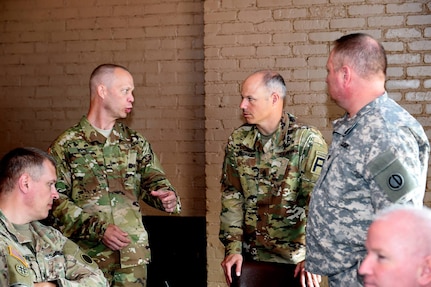 Command Sgt. Maj. Jeffrey Dillingham, center right, Command Sergeant Major, First Army Division West based in Fort Hood, Texas, converses with Army Reserve soldiers from the 85th Support Command's headquarters staff during a site visit here, June 30, 2016.
(Photo by Mr. Anthony L. Taylor)