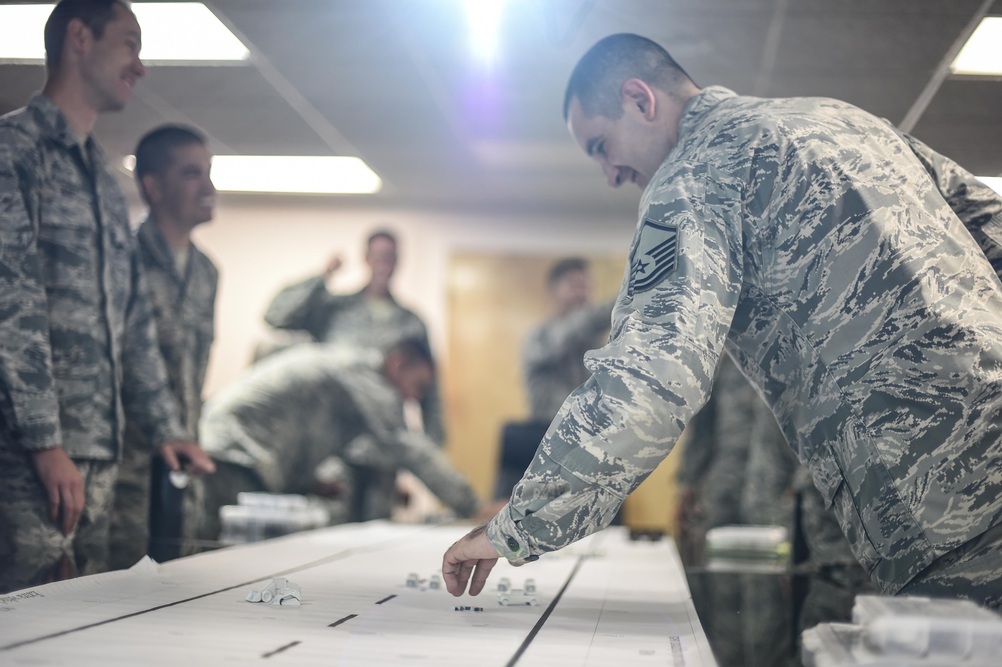 Members of the 49th Civil Engineer Squadron come together with the Rapid Airfield Damage Repair Modernization training team at Holloman Air Force Base N.M. on June 27 to implement the second part of a four phase training program for runway repair during and after an enemy attack. Mobile training teams will make their way to every Air Force Active Duty, Guard and Reserve installation to teach civil engineers RADR techniques. Over the next few years, this training will be implemented at all Civil Engineering Silver Flag training sites. (U.S. Air Force Photo by Staff Sgt. Stacy Moless)