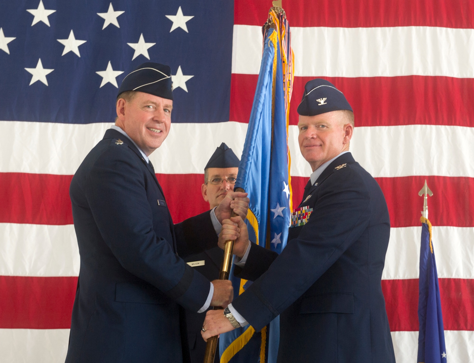 Col. Darrell Judy, right, accepts the guidon and command, of the 71st Flying Training Wing from Maj. Gen. James Hecker, the 19th Air Force commander, during a change-of-command ceremony June 28 at Vance Air Force Base, Oklahoma. Judy replaced Col. Clark Quinn. (U.S. Air Force photo/ Terry Wasson)
