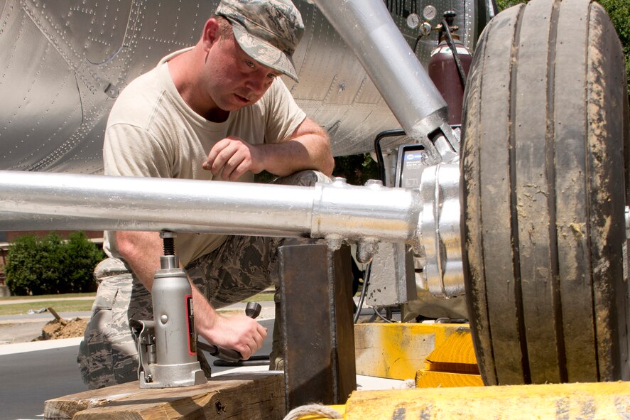 U.S. Air Force Tech. Sgt. Dusty Reynolds, a 314th Aircraft Maintenance Squadron crew chief, raises the landing gear of a Piasecki H-21 Workhorse helicopter for a static display mount installation at Little Rock Air Force Base, Ark., June 25, 2016. Airmen from the 314th and 19th Airlift Wings worked together to prepare, then secure the Korean War era helicopter to a cement pad, where it will remain on display for visitors to Little Rock AFB. On Aug. 24, 1954, an H-21C known as “Amblin' Annie,” with the assistance of inflight refueling, became the first helicopter to cross the United States nonstop. A dedication ceremony is scheduled for July 14 at 9 a.m. (U.S. Air Force photo by Master Sgt. Jeff Walston)   