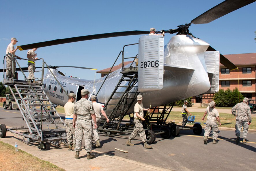 Airmen assigned to the 314th and 19th Airlift Wings, prepare a Piasecki H-21 Workhorse helicopter for permanent display at Little Rock Air Force Base, Ark., June 25, 2016. The H-21 is a part of 314th AW history, which was activated in November 1948 as the 314th Troop Carrier Wing at Smyrna Air Force Base, Tenn.  The Workhorse, which was commonly known as the “flying banana," was a multi-mission helicopter, utilizing wheels, skis, or floats. It served during the latter part of the Korean War and transported supplies to Korea and evacuated prisoners of war. A dedication ceremony is scheduled for July 14 at 9 a.m. (U.S. Air Force photo by Master Sgt. Jeff Walston)