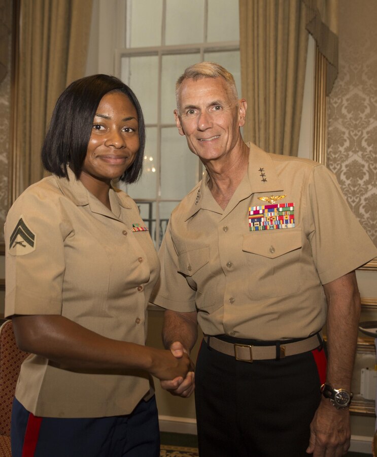 Lt. Gen. Rex C. McMillian (right), commander of Marine Forces Reserve and Marine Forces North, congratulates Cpl. Shereka K. Slater (left), an administrative specialist with Marine Forces Reserve Installation Personnel Administration Center, who received the Navy League of the United States Greater New Orleans Council’s Marine of the Year Award for Marine Forces Reserve at “A Taste’n Toast to Our Armed Services” event at the Bourbon Orleans Hotel, New Orleans, July 30, 2016.  The award was presented to Slater for her outstanding service to MARFORRES. The Navy League is comprised of 40,000 civilians in more than 240 councils around the world working to support sea service members and their families. (U.S. Marine Corps photo by Sgt. Ian Leones/Released)
