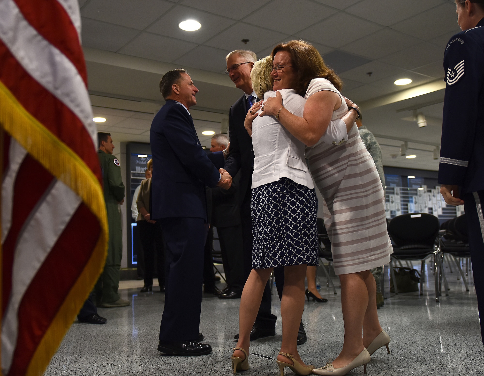 Air Force Chief of Staff Gen. David L. Goldfein and his wife, Dawn, shake hands and give hugs to well-wishers after Goldfein's swearing-in ceremony at the Pentagon in Washington, D.C., June 1, 2016. Goldfein became the 21st chief of staff of the Air Force. (U.S. Air Force photo/Tech Sgt. Dan DeCook)