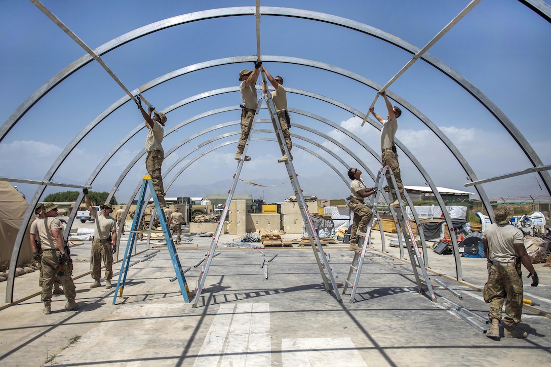 Airmen construct a new tent at Bagram Airfield, Afghanistan, June 25, 2016. The airmen are assigned to the 455th Expeditionary Civil Engineer Squadron. Air Force photo by Senior Airman Justyn M. Freeman