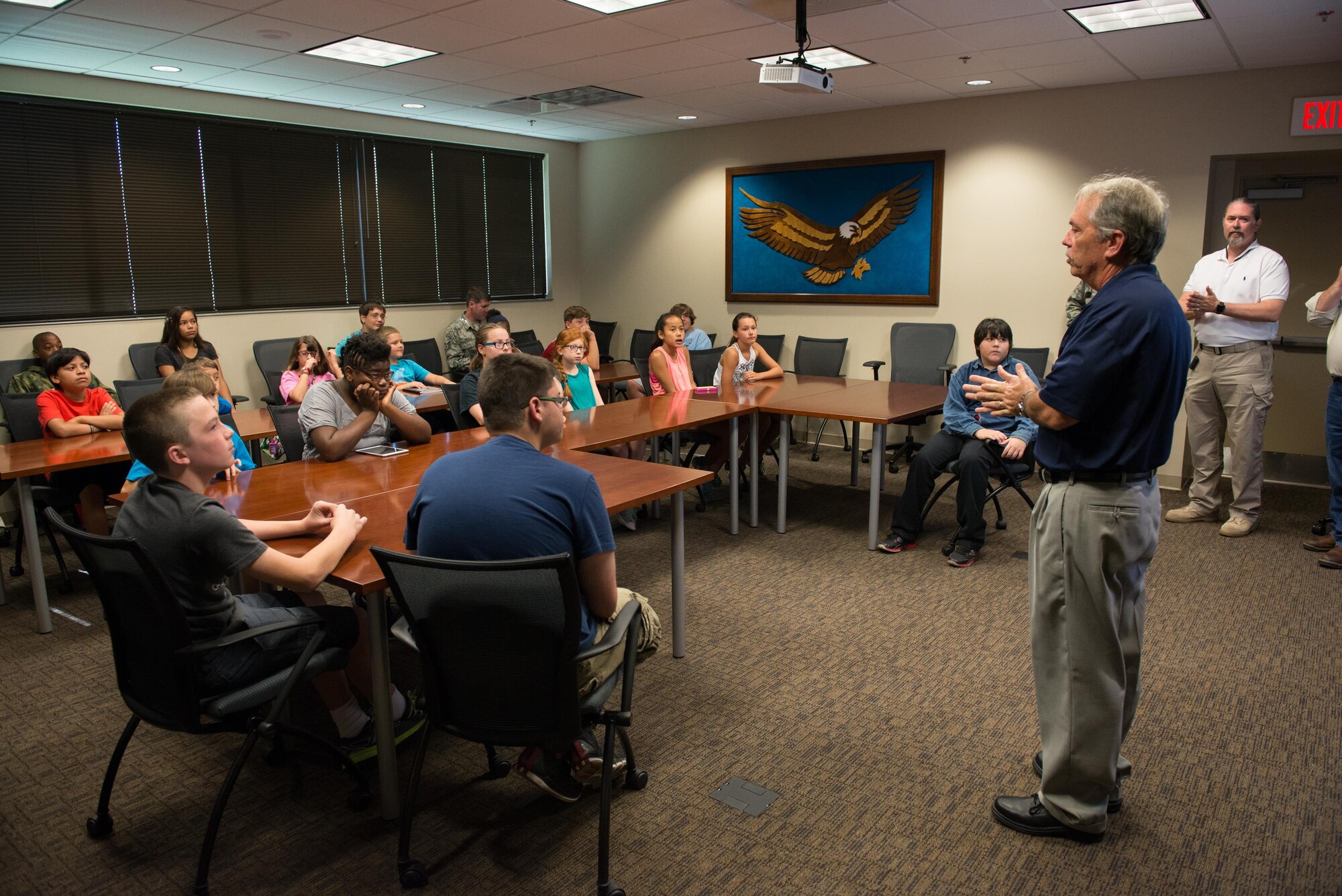 David Carley, 81st Training Support Squadron instructional technology unit chief, explains safety procedures and policies before students from the Science, Technology, Engineering, and Mathematics Camp begin a tour of the Trainer Development Center June 23, 2016, on Keesler Air Force Base, Miss. Keesler partnered with the Biloxi School District, Biloxi, Miss. in a week-long summer program designed to educate and enrich middle school students interested in science, technology, engineering or mathematics. (U.S. Air Force photo by Marie Floyd/Released)