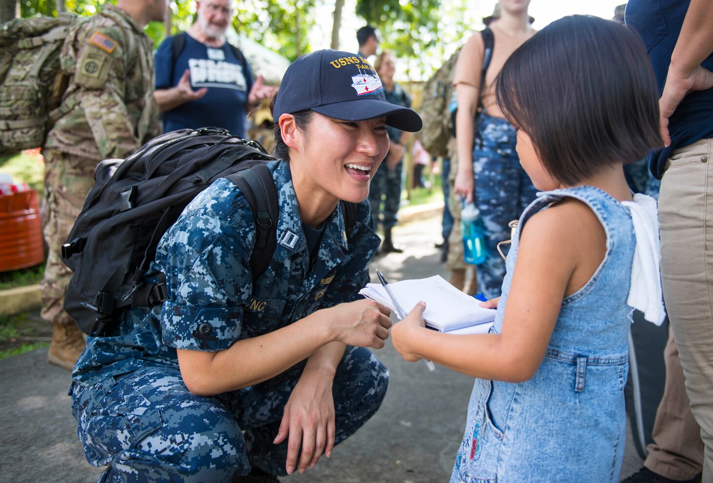 LIGAO CITY, Philippines (June 28, 2016) - Lt. Gabrielle Jung, a Navy dentist and native of Aurora, Colorado (left), talks with a student at Ligao West Central Elementary School during Pacific Partnership 2016. Jung was at the school as part of a cooperative health engagement where Pacific Partnership 2016 personnel attached to hospital ship USNS Mercy (T-AH 19) and members of the Armed Forces of the Philippines spent the day educating people on health care, hygiene and nutrition. Participants also provided direct care services including optometry, dental care and physical therapy. Pacific Partnership is visiting the Philippines for the seventh time since its first mission in 2006. Partner nations will work side-by-side with local military and non-government organizations to conduct cooperative health engagements, community relation events and subject matter expert exchanges to better prepare for a natural disaster or crisis. 