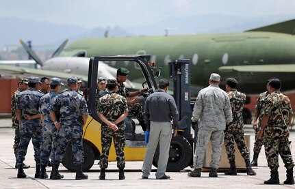 Participants of a subject-matter expert exchange on cargo handling learn how to operate a forklift June 28, 2016, at Tribhuvan International Airport in Kathmandu, Nepal. During the SMEE, participants familiarized themselves with forklift operation and learned cargo transportation techniques. 