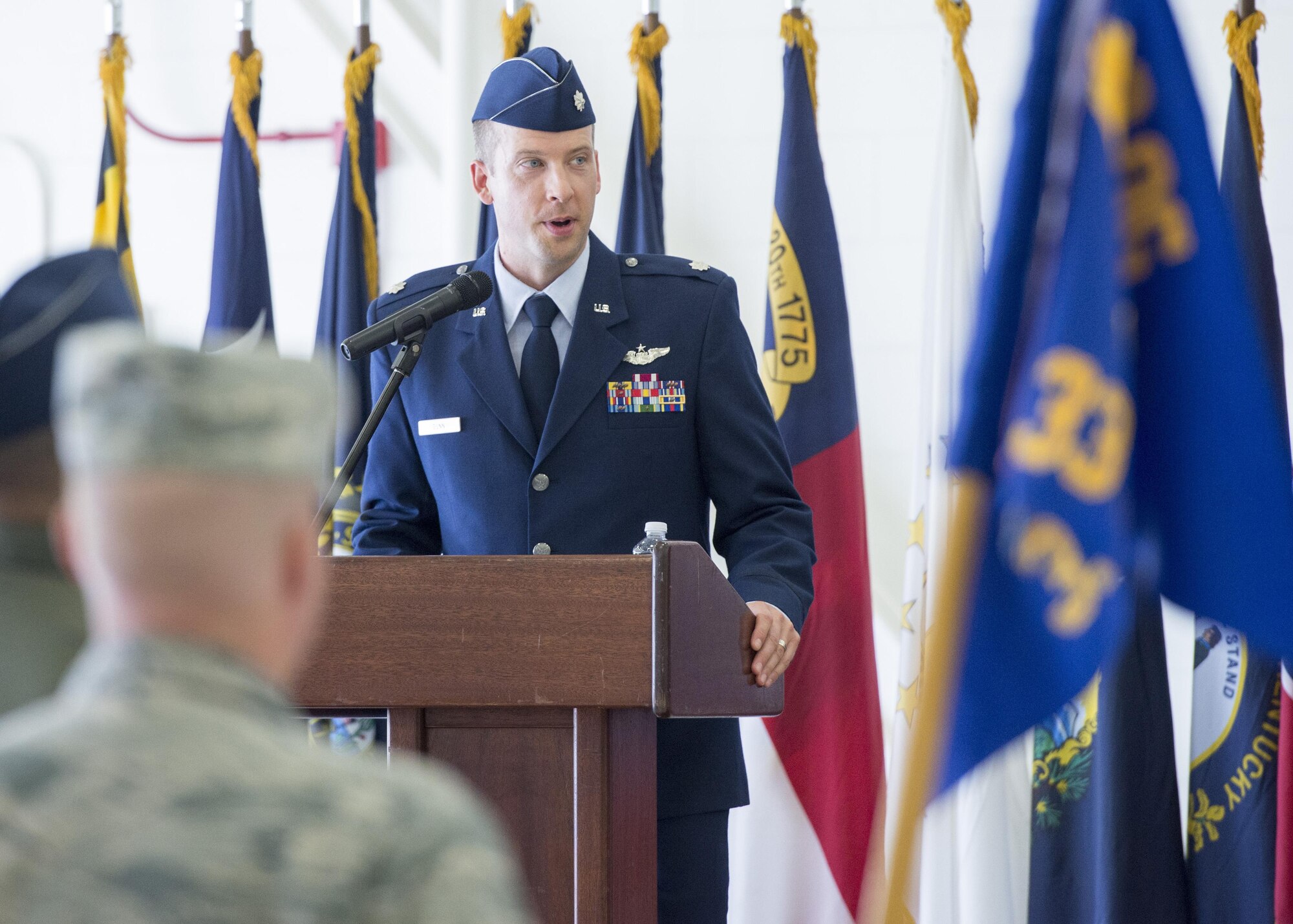 Lt. Col. Scott Gunn, 33rd Operations Support Squadron commander, speaks to 33rd OSS Airmen during the 33rd OSS change of command ceremony June 24, 2016, at Eglin Air Force Base, Fla. The 33rd OSS oversees F-35 weapons and tactics training and aircrew flight equipment training at Eglin AFB as well as the training syllabus and operational intelligence training for both AFSOC and the F-35 program at Eglin AFB. (U.S. Air Force photo by Senior Airman Stormy Archer/Released)
