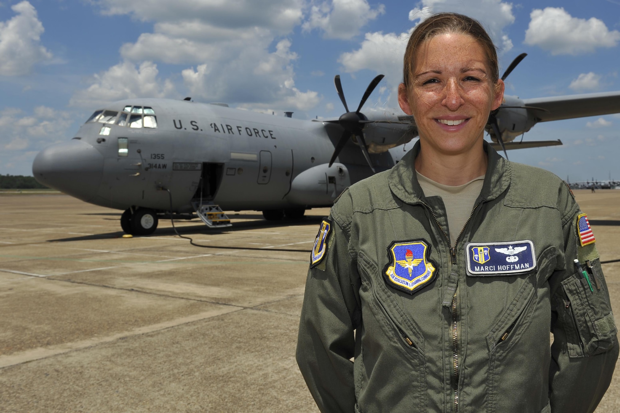 U.S. Air Force Maj. Marci Hoffman, 314th Operations Group training office flight commander, oversees all training performed by the 61st Airlift Squadron and the 48th Airlift Squadron at Little Rock Air Force Base, Ark. During her most recent deployment, Hoffman advised and assisted Iraqi air force members specializing in the C-130J aircraft to further their air mobility training program and overall mission. (U.S. Air Force photo by Kevin Sommer Giron) 