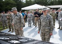 U.S. Air Force Brig. Gen. Timothy LaBarge, New York Air National Guard chief of staff, left, and Col. Howard Wagner, 105th Airlift Wing commander, view a memorial, June 30, 2016, at Moody Air Force Base, Ga. Many organizations from the base and the local community donated time, materials and funds toward the materials and construction of the memorial. (U.S. Air Force photo by Airman 1st Class Janiqua P. Robinson/Released)