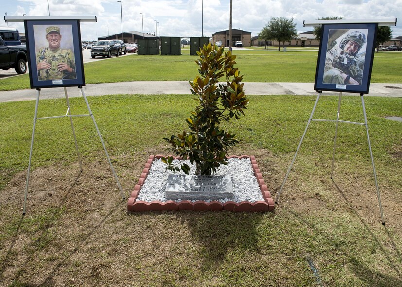 A tree planted in honor of two fallen Airmen is displayed  during a memorial service, June 30, 2016, at Moody Air Force Base, Ga. In honor of U.S. Air Force Tech. Sgt. Joseph G. Lemm, left, and Staff Sgt. Louis M. Bonacasa, a Magnolia Tree was planted along with a memorial engraved with their legacies. (U.S. Air Force photo by Airman 1st Class Janiqua P. Robinson/Released)