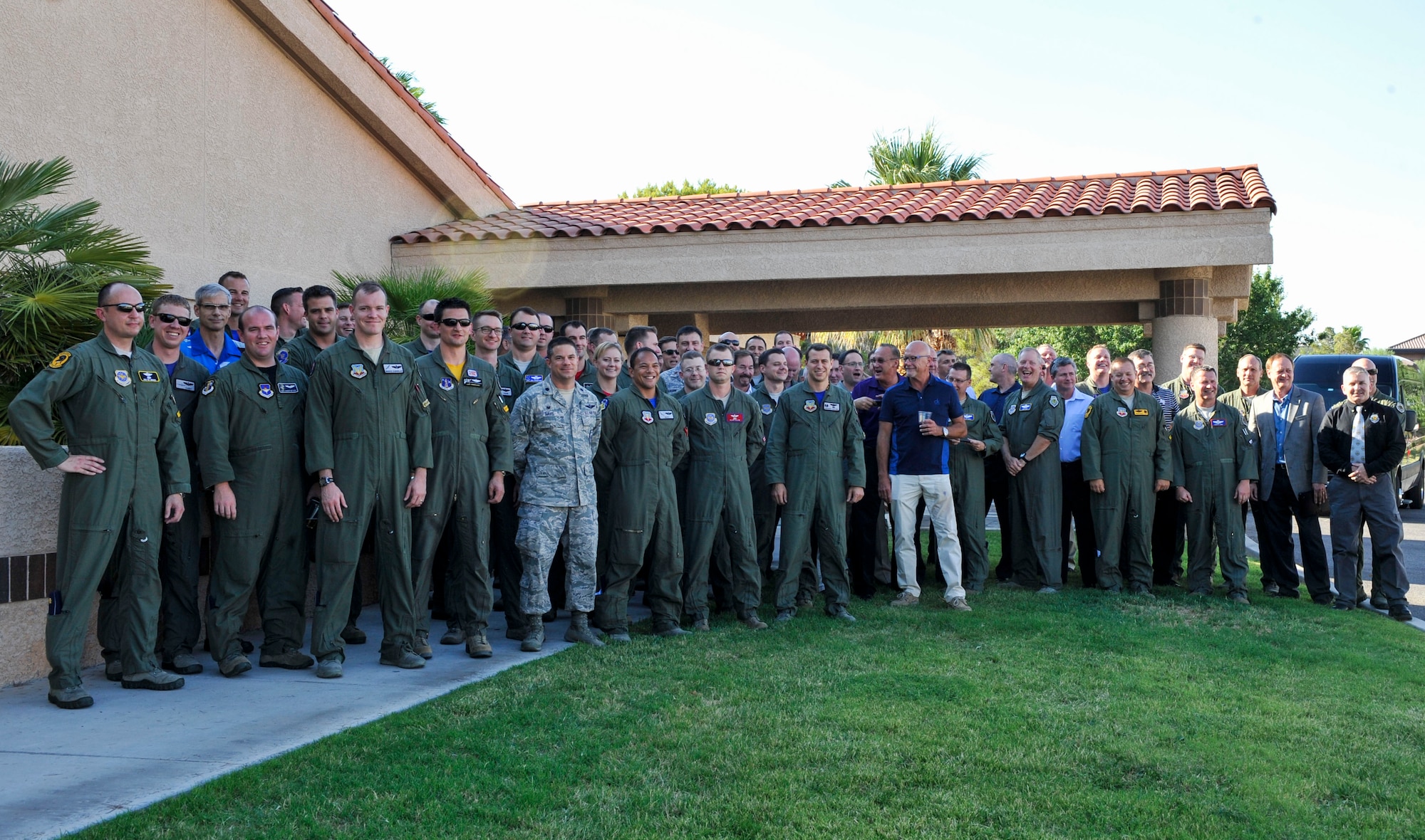 U.S. Air Force C-130 Weapons Instructor Course members gather outside for a 20-year anniversary group photo June 24, 2016, at Nellis Air Force Base, Nev. With the recent graduation of class 16A, the C-130 WIC has graduated 304 Weapons Officers, transforming the face of tactical employment and joint force integration.  (U.S. Air Force photo by Senior Airman Stephanie Serrano)