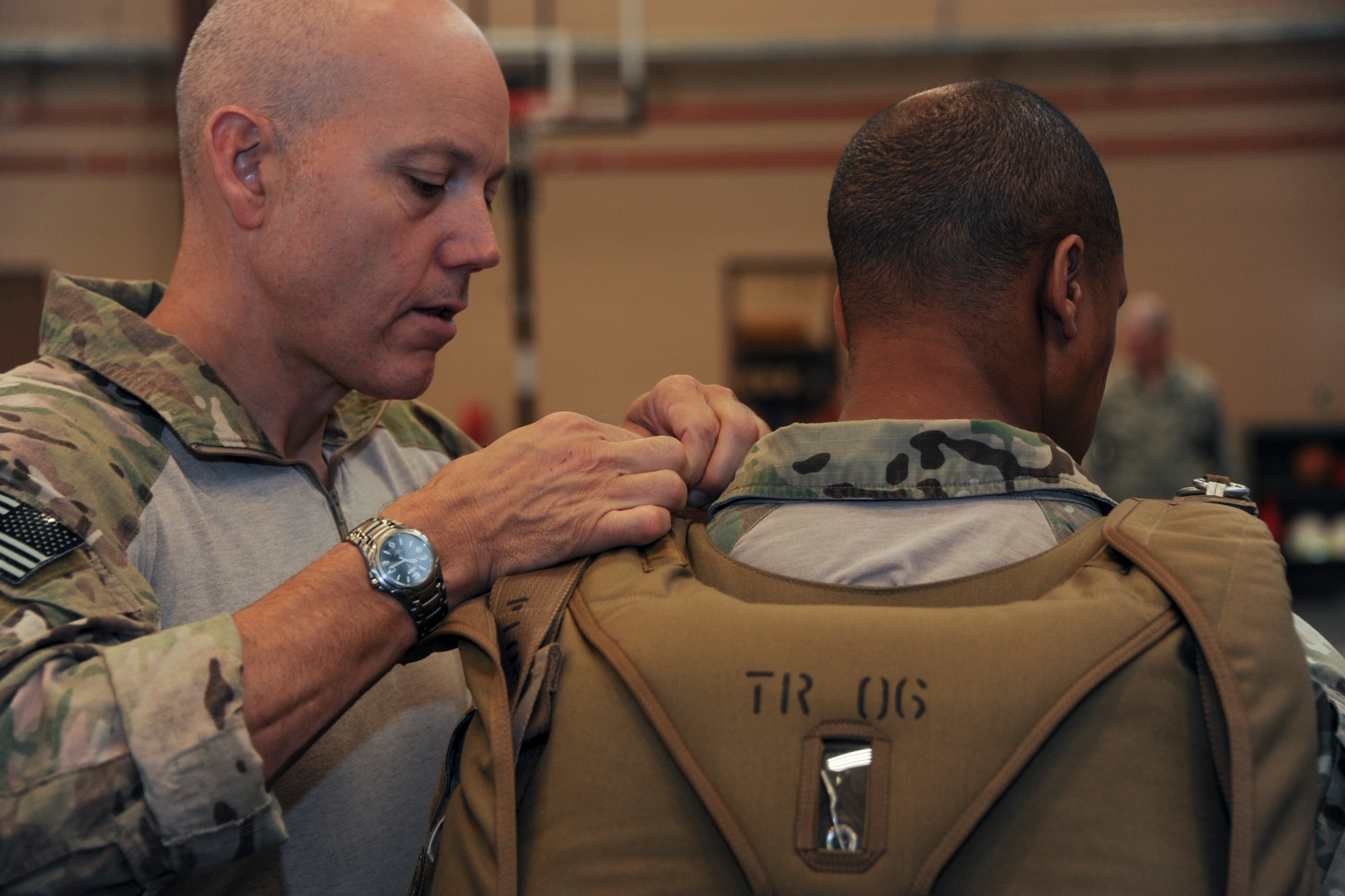 U.S. Air Force Master Sgt. David Biddinger, 563rd Rescue Group jumpmaster course instructor, performs a jumpmaster personnel inspection during the Military Freefall Jumpmaster Course at Davis-Monthan Air Force Base, Ariz., June 28, 2016. Jumpmasters must be highly proficient in every component of the jump process, from ensuring equipment is donned properly, to coordinating with the aircrew during the release so jumpers land on the designated drop zone. (U.S. Air Force photo by Airman Nathan H. Barbour/Released)