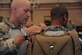 Master Sgt. David Biddinger, a 563rd Rescue Group jumpmaster course instructor, performs a jumpmaster personnel inspection during the Military Freefall Jumpmaster Course at Davis-Monthan Air Force Base, Ariz., June 28, 2016. Jumpmasters must be highly proficient in every component of the jump process, from ensuring equipment is donned properly to coordinating with the aircrew during the release so jumpers land on the designated drop zone. (U.S. Air Force photo/Airman Nathan H. Barbour)